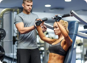 A person doing a workout with a trainer