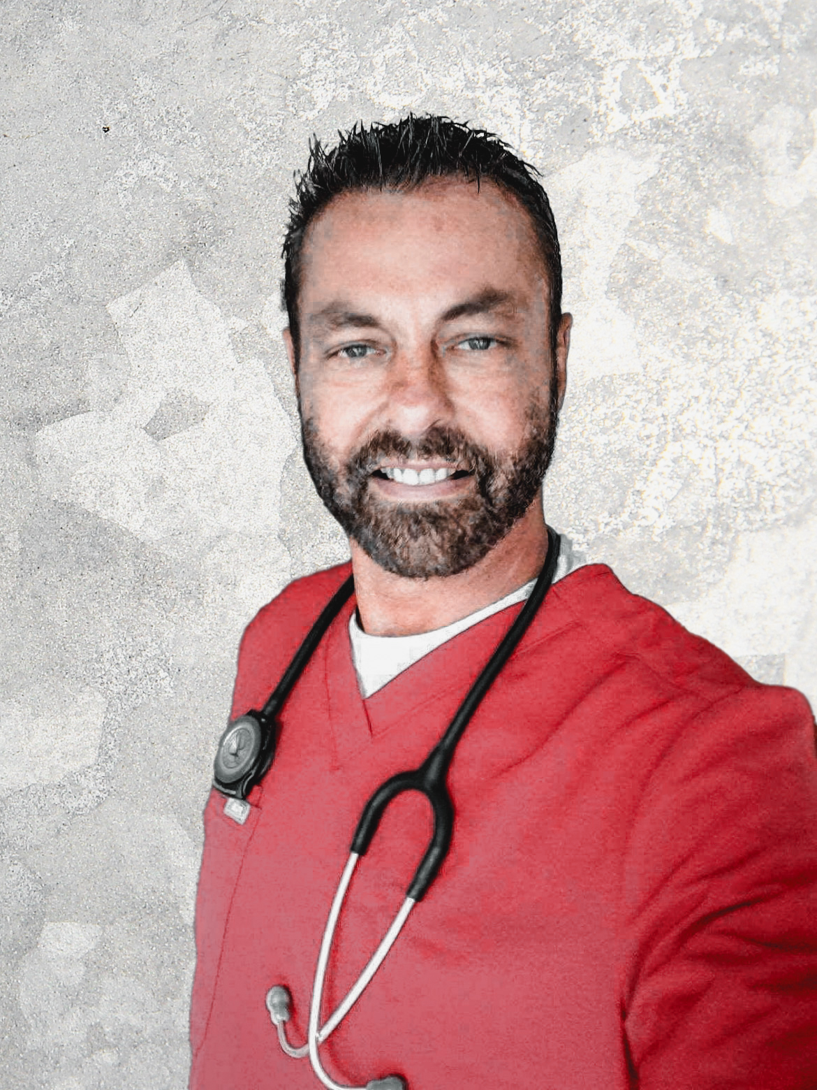 A healthcare professional wearing a red scrub suit